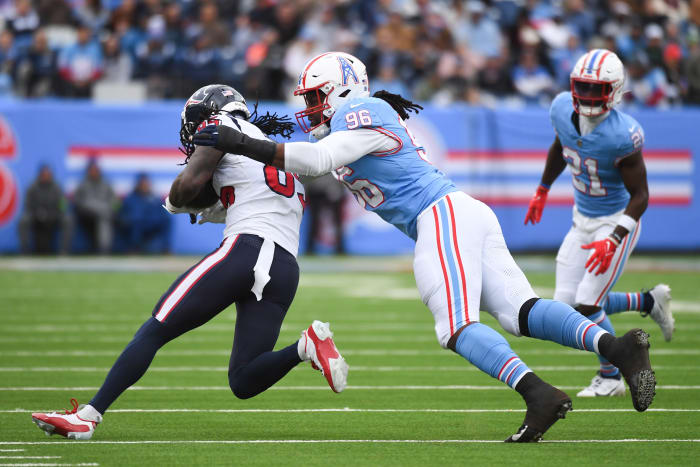 Texans wide receiver Noah Brown (85) is tackled by Tennessee Titans defensive end Denico Autry (96) during the first half at Nissan Stadium.